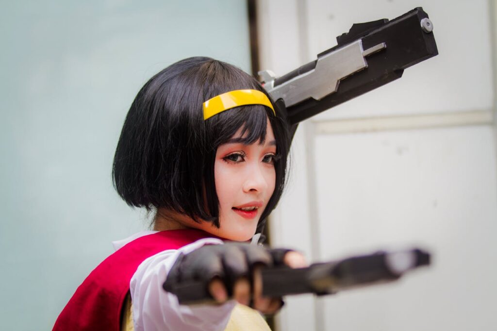 Close-up of a woman in cosplay attire aiming toy guns, showcasing detailed cosplay makeup and attire.